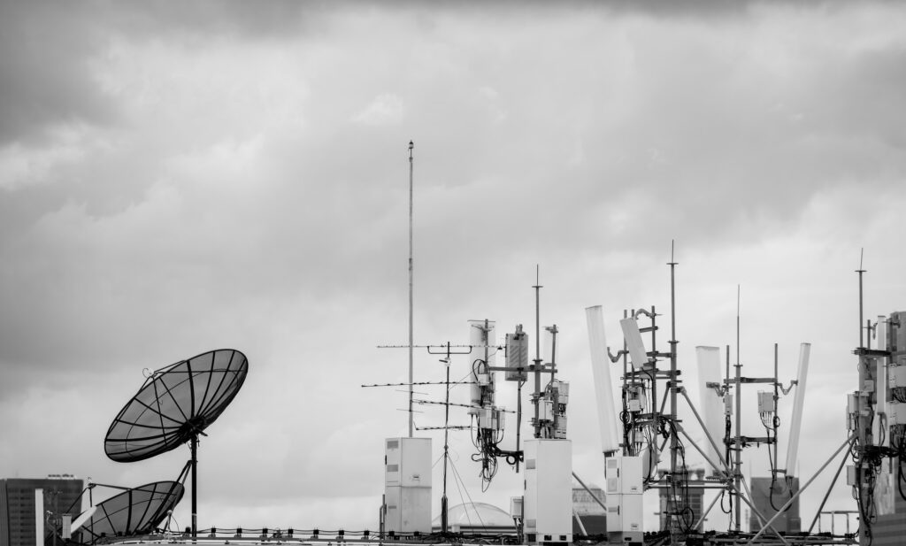 Telecommunication equipment for 5g radio network. Telecommunication tower, antenna, and satellite
